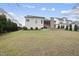 View of the back of the house showing the patio, back porch, and back yard at 2073 Amalfi Pl, Apex, NC 27502