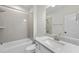Bathroom with a tiled shower and tub, vanity with a white marble countertop, and a toilet at 2073 Amalfi Pl, Apex, NC 27502