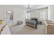 Cozy bedroom featuring natural light, chandelier, and en suite bathroom at 2073 Amalfi Pl, Apex, NC 27502