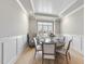 Charming dining area with wainscoting, a round table, and stylish decor at 2073 Amalfi Pl, Apex, NC 27502
