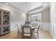 Charming dining area with wainscoting, a round table, and stylish decor at 2073 Amalfi Pl, Apex, NC 27502