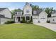 Beautiful two-story home with a manicured lawn, attached garages, and gorgeous curb appeal at 2073 Amalfi Pl, Apex, NC 27502