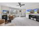 Spacious game room is equipped with multiple TVs, comfortable seating, and stylish decor at 2073 Amalfi Pl, Apex, NC 27502