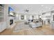 Spacious living room featuring a fireplace, built-in shelves, and an open floor plan at 2073 Amalfi Pl, Apex, NC 27502