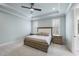 Stunning main bedroom with tray ceiling, ceiling fan, and plantation shutters at 2073 Amalfi Pl, Apex, NC 27502