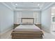 Stunning main bedroom with tray ceiling, recessed lights, and plantation shutters at 2073 Amalfi Pl, Apex, NC 27502