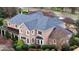 Elevated perspective showcases the property's brick facade, perfectly manicured landscaping, and private setting at 212 Whirlaway Ln, Chapel Hill, NC 27516