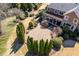Aerial perspective capturing the home's elegant backyard patio and lush landscaping at 212 Whirlaway Ln, Chapel Hill, NC 27516