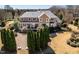 Stunning aerial view showcasing the home's grand facade, meticulously landscaped grounds, and inviting curb appeal at 212 Whirlaway Ln, Chapel Hill, NC 27516