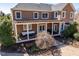 A spacious back porch is featured in this home's backyard with outdoor seating and plenty of natural light at 212 Whirlaway Ln, Chapel Hill, NC 27516