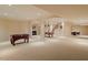 Spacious basement featuring a billiards table, fireplace, and foosball table at 212 Whirlaway Ln, Chapel Hill, NC 27516