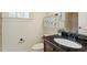 Well-lit bathroom with a modern vanity, sleek fixtures, and decorative accents at 212 Whirlaway Ln, Chapel Hill, NC 27516