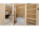 Bathroom showing tub/shower combo with shelves and seating area beyond at 212 Whirlaway Ln, Chapel Hill, NC 27516