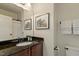 Bathroom features a granite countertop, bronze fixtures, and framed art at 212 Whirlaway Ln, Chapel Hill, NC 27516