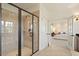Modern bathroom showcases a glass shower, double doors, and access to bedroom area at 212 Whirlaway Ln, Chapel Hill, NC 27516