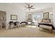Well-lit bedroom with plush carpet, ceiling fan, and two twin beds with bedside tables at 212 Whirlaway Ln, Chapel Hill, NC 27516