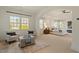 Airy bedroom featuring seating area with comfortable armchairs and lots of natural light at 212 Whirlaway Ln, Chapel Hill, NC 27516