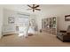 Bedroom room featuring a play teepee, ceiling fan, shelving, and natural light at 212 Whirlaway Ln, Chapel Hill, NC 27516