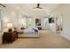 Bright bedroom with plush carpet, neutral decor, and a king bed with cushioned headboard at 212 Whirlaway Ln, Chapel Hill, NC 27516