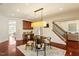 Breakfast nook with adjacent desk and staircase to the upper level at 212 Whirlaway Ln, Chapel Hill, NC 27516