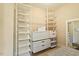 Walk-in closet featuring custom shelving and drawer organization for optimal storage at 212 Whirlaway Ln, Chapel Hill, NC 27516
