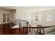 Bright foyer boasts hardwood floors, decorative wrought iron banister, and chandelier lighting at 212 Whirlaway Ln, Chapel Hill, NC 27516