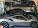 Three vehicles in residential garage with lift for stacking cars at 212 Whirlaway Ln, Chapel Hill, NC 27516