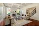 Bright living room features a coffered ceiling, fireplace, and hardwood floors at 212 Whirlaway Ln, Chapel Hill, NC 27516