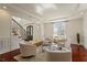 Elegant living room boasts hardwood floors, and wainscoting, creating a luxurious and inviting atmosphere at 212 Whirlaway Ln, Chapel Hill, NC 27516