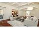 Bright living room features a coffered ceiling, fireplace, and hardwood floors at 212 Whirlaway Ln, Chapel Hill, NC 27516
