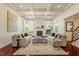 Bright living room features a coffered ceiling, fireplace, and hardwood floors at 212 Whirlaway Ln, Chapel Hill, NC 27516