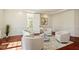 Cozy sitting room with wainscoting, hardwood floors, and neutral furnishings at 212 Whirlaway Ln, Chapel Hill, NC 27516