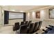 Home theater features tiered seating, large screen, and movie posters at 212 Whirlaway Ln, Chapel Hill, NC 27516