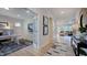 Open hallway view leading to the living room and home office with natural light at 230 Tidal Pool Way, Cary, NC 27519