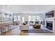 Bright living room featuring hardwood floors, contemporary decor, and a cozy fireplace at 230 Tidal Pool Way, Cary, NC 27519