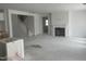 Spacious open-concept living room with a fireplace and stairs leading to the upper level, ready for personalization at 230 Tidal Pool Way, Cary, NC 27519