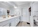 Bathroom boasting double sinks, white cabinets, a closet and a separate toilet area at 244 Mahogany Run, Raleigh, NC 27610