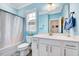 Bright bathroom featuring a vanity, mirror, toilet and bathtub with shower at 244 Mahogany Run, Raleigh, NC 27610