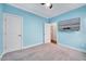 Bedroom featuring carpeted floor and a television mounted on the wall at 244 Mahogany Run, Raleigh, NC 27610