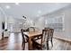 Bright dining area offering natural light and a seamless connection to the living room at 244 Mahogany Run, Raleigh, NC 27610