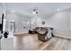 Cozy living room with a comfortable sectional sofa and access to the outdoor space at 244 Mahogany Run, Raleigh, NC 27610