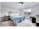 Serene main bedroom with a tray ceiling, a comfortable bed, and plenty of natural light at 244 Mahogany Run, Raleigh, NC 27610