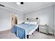 Inviting main bedroom featuring a plush bed and a stylish nightstand at 244 Mahogany Run, Raleigh, NC 27610