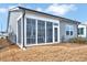 Screened porch with views of the yard and surrounding trees, inviting relaxation at 244 Mahogany Run, Raleigh, NC 27610