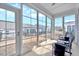 This screened porch features large windows and comfortable seating to enjoy the outside view at 244 Mahogany Run, Raleigh, NC 27610