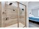 Modern shower featuring tile surround, a rainfall shower head and a glass enclosure at 244 Mahogany Run, Raleigh, NC 27610