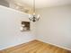 Bright dining room featuring hardwood floors and a modern chandelier at 27 Kings Mount Ct, Durham, NC 27713