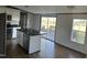 Eat-in kitchen with a center island, stainless steel appliances, and sliding door to the deck at 30 Jamestown Ct Ct, Zebulon, NC 27597