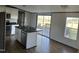 Modern kitchen featuring a center island, stainless steel appliances, and a sliding door to the back deck at 30 Jamestown Ct Ct, Zebulon, NC 27597