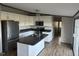 Well-lit kitchen with stainless steel appliances and white cabinets, great for cooking and entertaining at 30 Jamestown Ct Ct, Zebulon, NC 27597